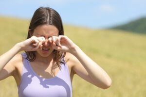 Woman Struggling with Dry Eye in Summer