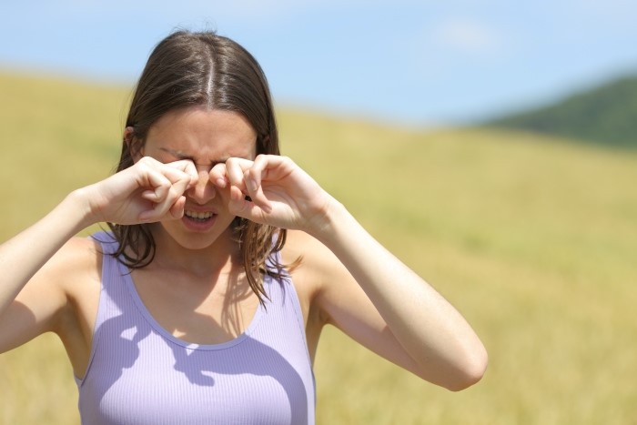Woman Struggling with Dry Eye in Summer